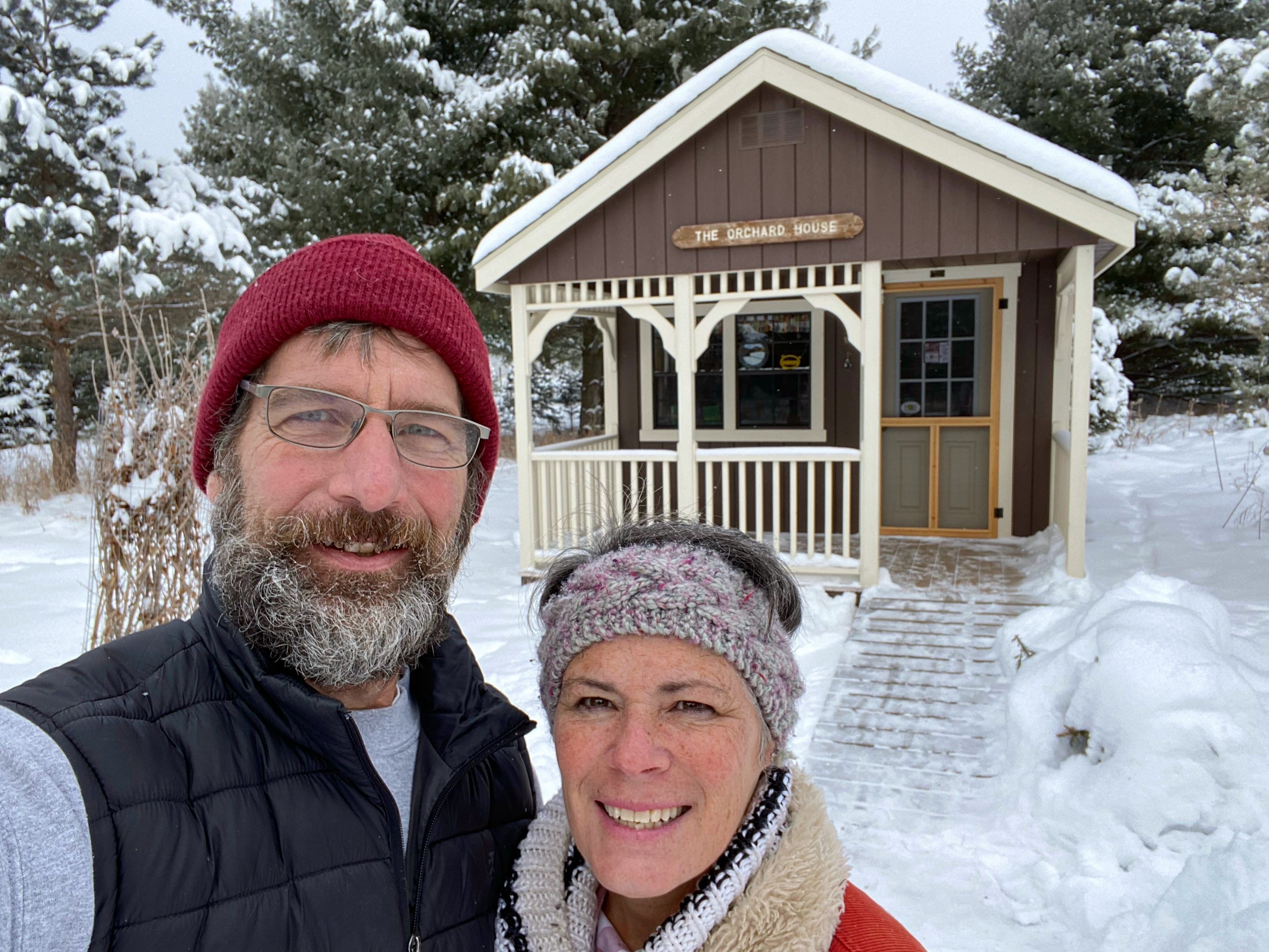 Kim and Craig Yolitz at McKenzie Orchard in Spooner Wisconsin in front of their retail cabin shed store