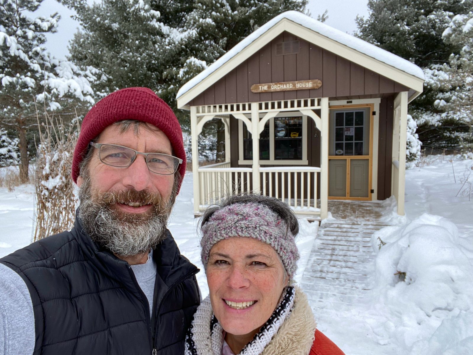 Kim and Craig Yolitz at McKenzie Orchard in Spooner Wisconsin in front of their retail cabin shed store