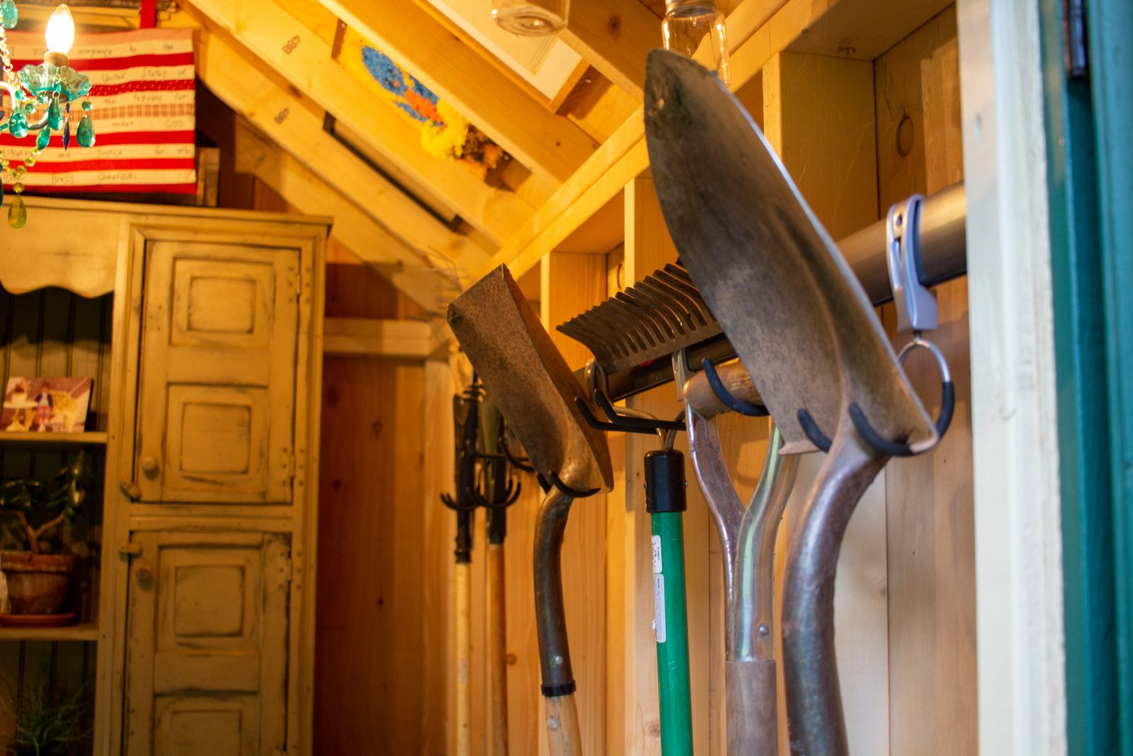 Garden tools neatly organized in wisconsin she shed