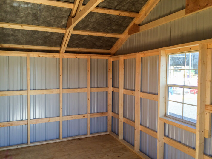 interior of steel outdoor shed with wood purlin construction